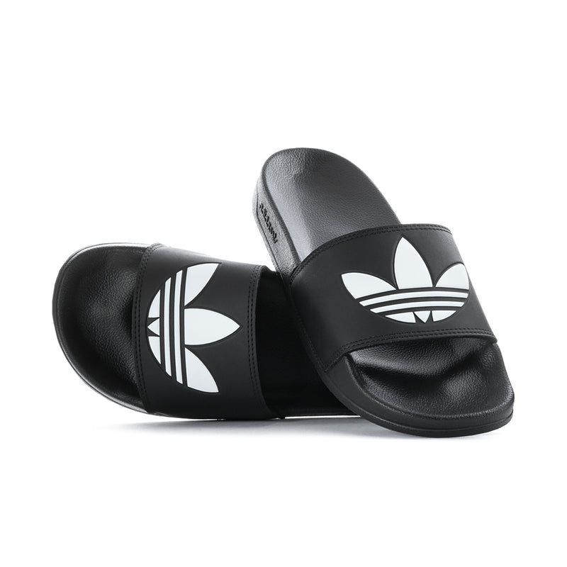 Pair of men's black slide sandals with white adidas trefoil logos on straps