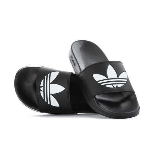 Pair of men's black slide sandals with white adidas trefoil logos on straps