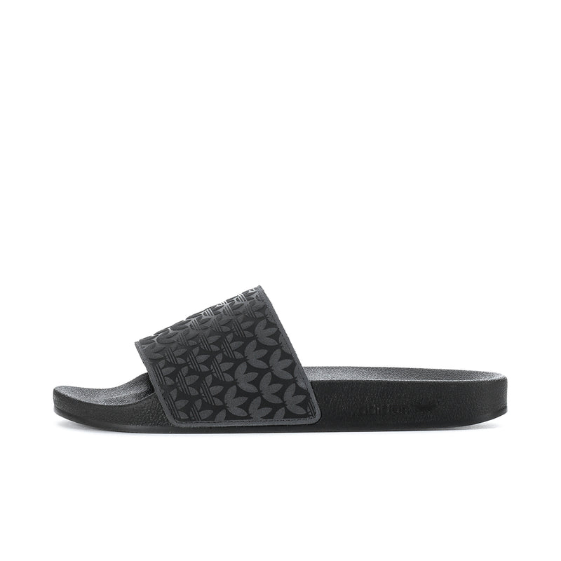 Men's black slide sandals, side profile with leaf-patterned band over contoured footbed