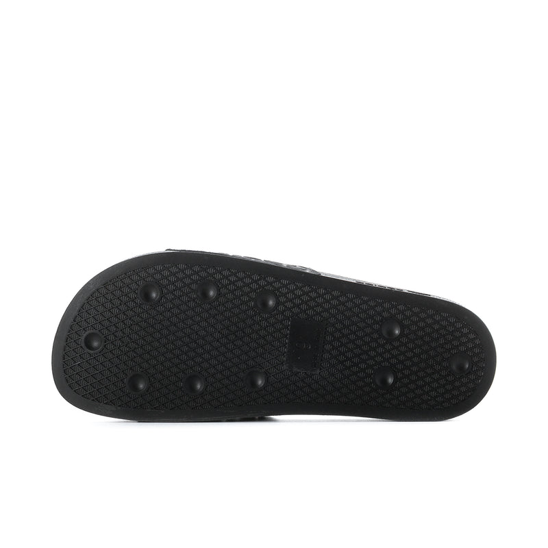 Men's black slide sandals outsole with textured tread and circular grip nubs