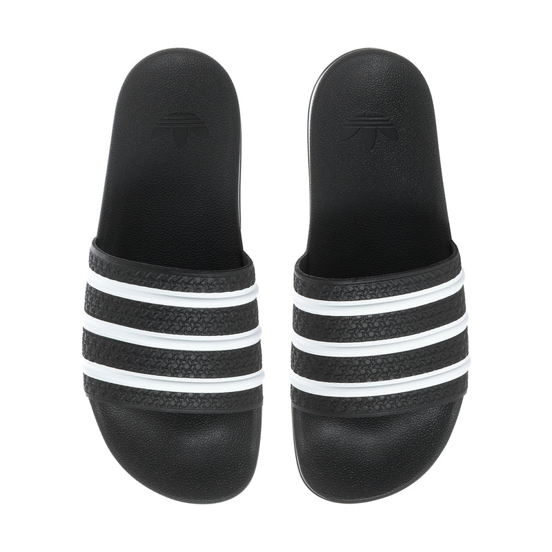 Men's black slide sandals showing three white stripe heel bands