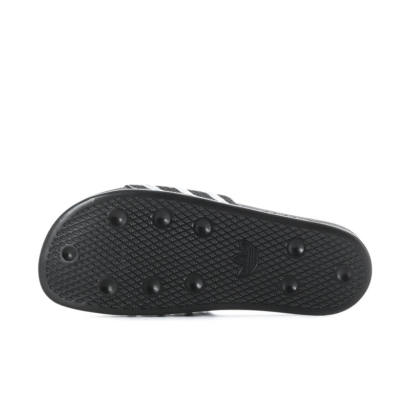 Men's black rubber outsole with raised tread dots and pattern