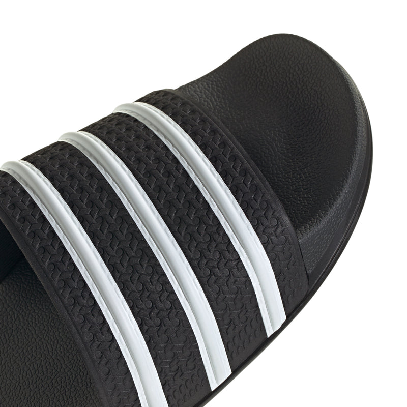 Men's black slide sandals with textured straps and three white stripes