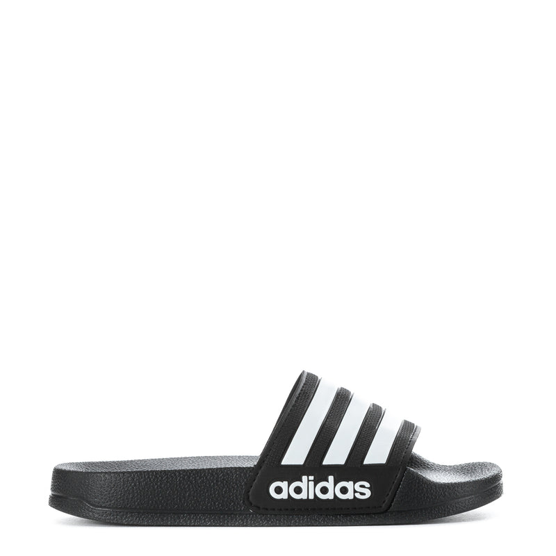Kids black slide sandal with three white adidas stripes, side view
