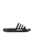 Kids black slide sandal with three white adidas stripes, side view