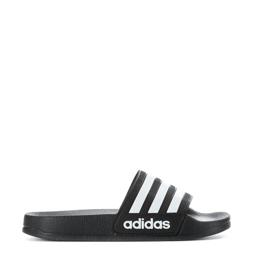 Kids black slide sandal with three white adidas stripes, side view