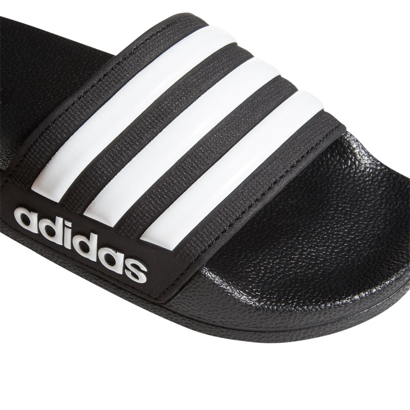 Kids black slide sandal strap with white three adidas stripes