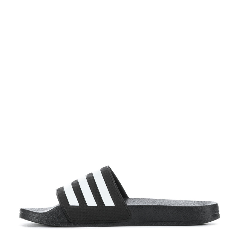 Youth slide sandal, black footbed with white three-stripe graphic and adidas logo