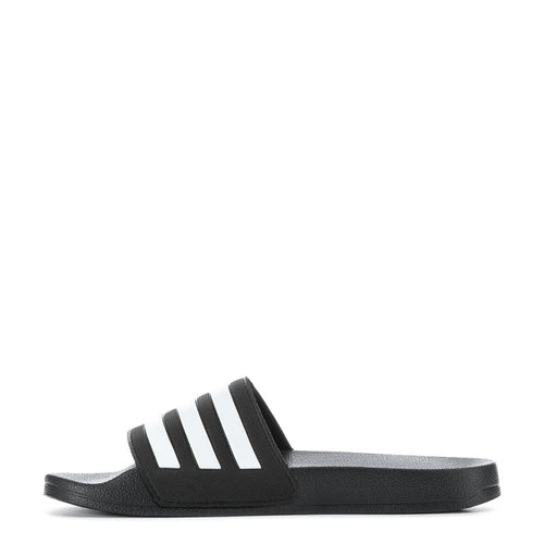 Youth slide sandal, black footbed with white three-stripe graphic and adidas logo