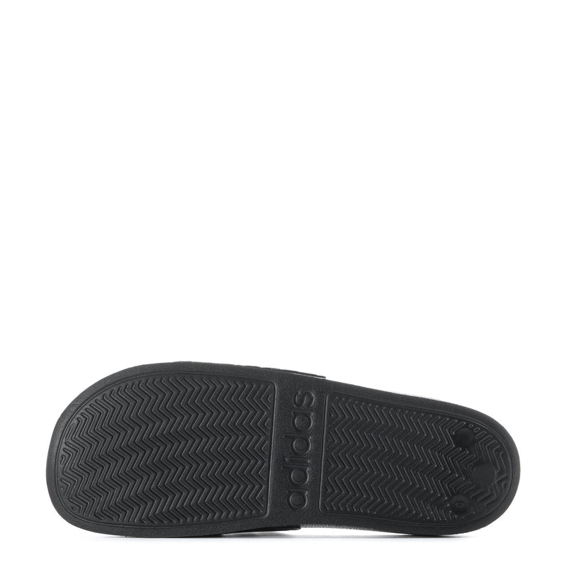 Black rubber outsole with zigzag tread pattern and adidas branding