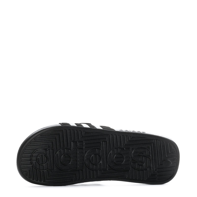 Men's black adidas slide sandal outsole tread with textured traction pattern