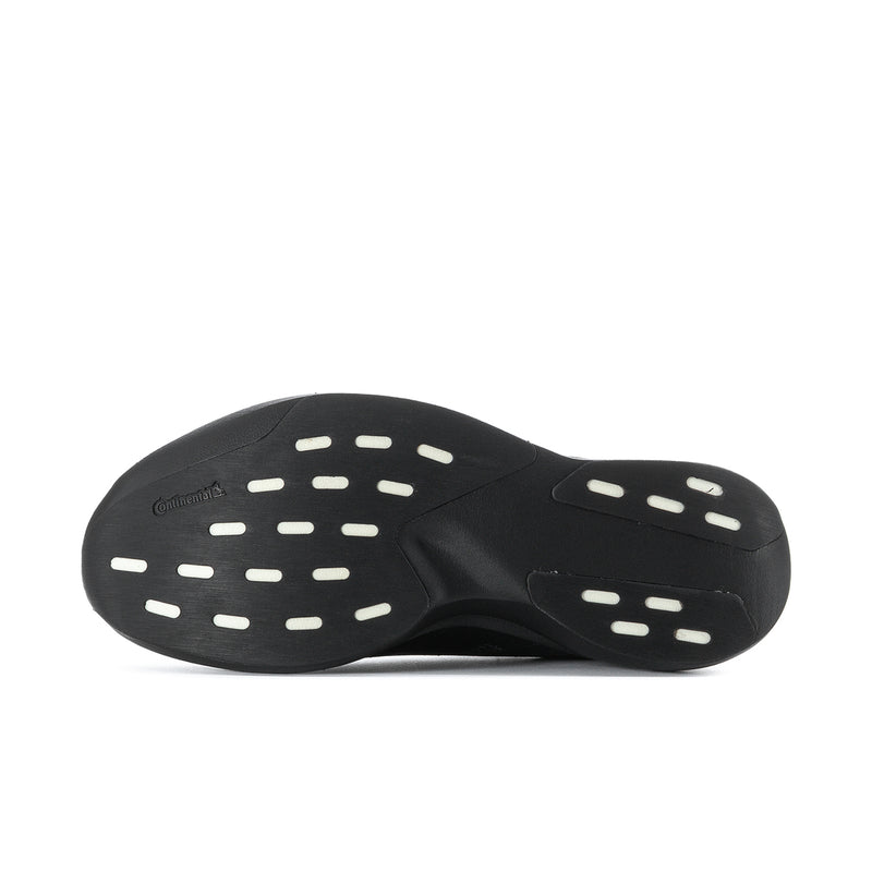 Black shoe outsole with oval traction pods for grip