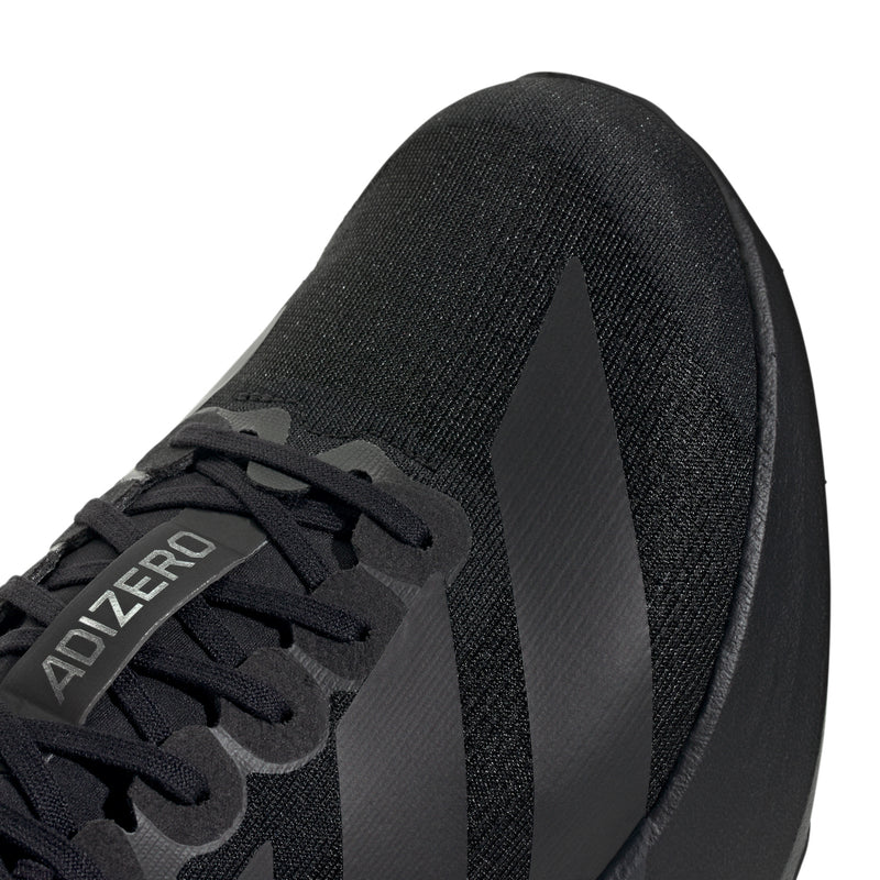 Black shoe upper close-up with lace panel and Adizero branding