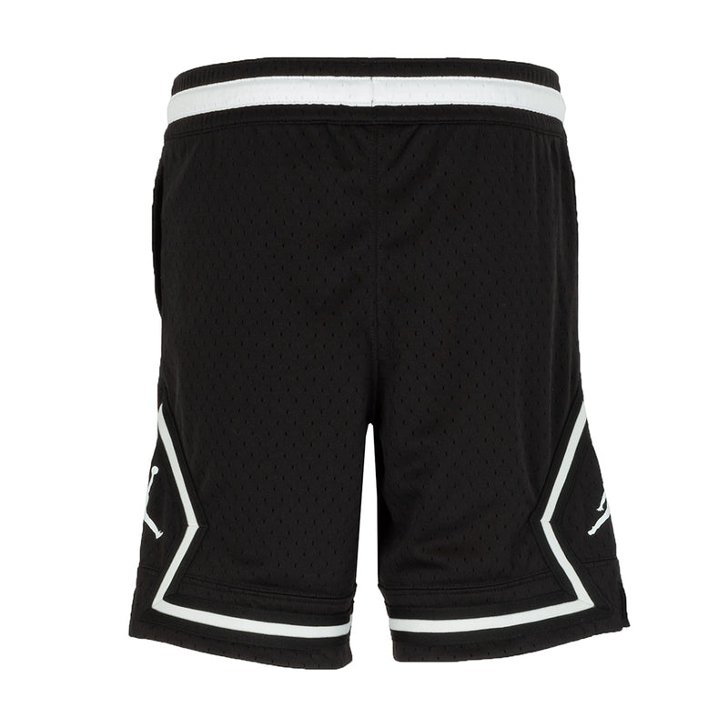 Youth black basketball shorts with white piping on back, diamond texture
