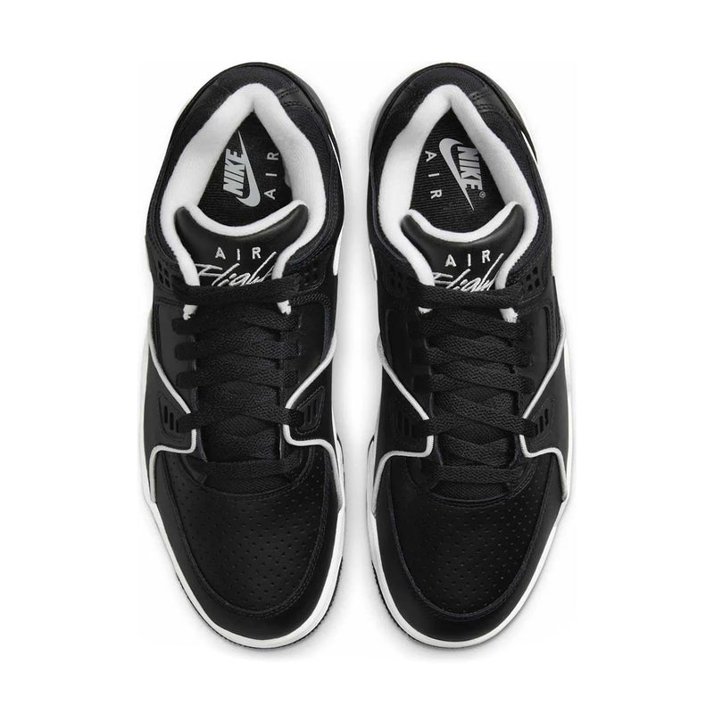 Pair of black lace-up Air sneakers with white accents and tongue branding