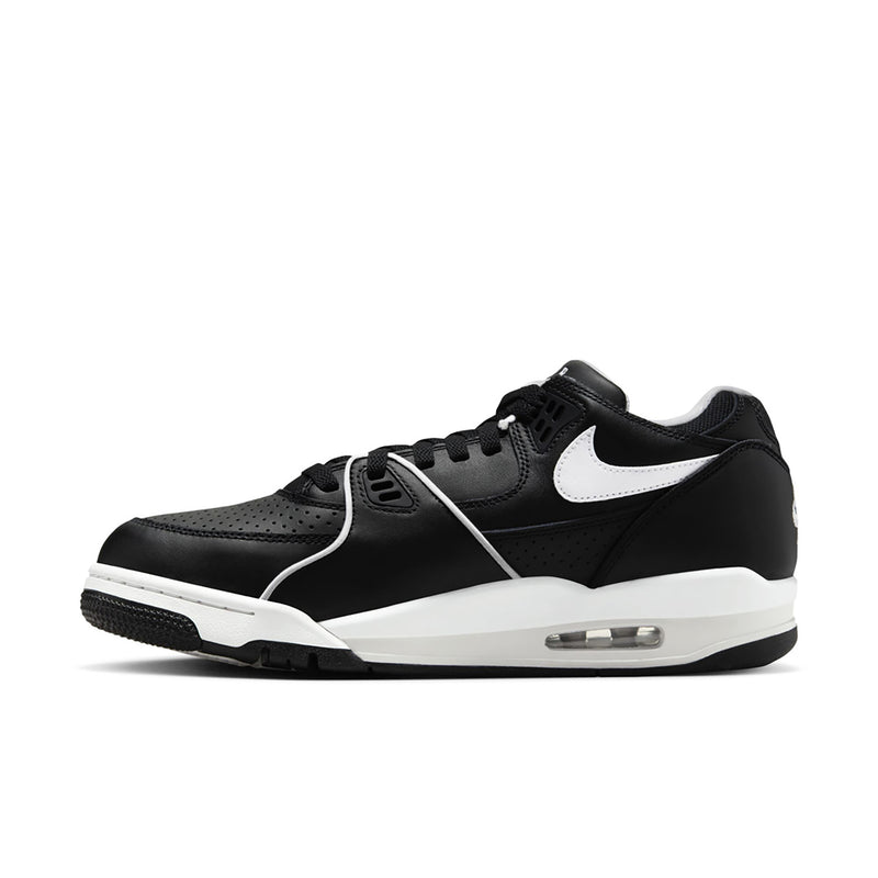 Black and white Air low-top sneakers, side profile with white swoosh and Air window