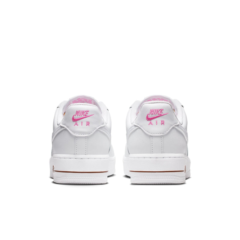 Women’s white sneakers rear view with Nike Air branding and pink floral heel detail