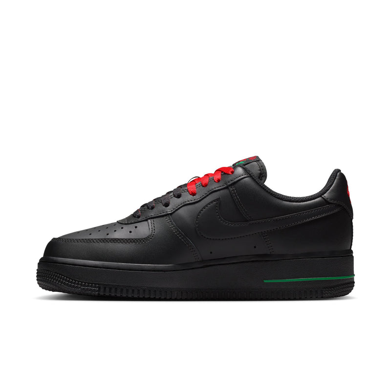 Womens Nike Air Force 1 low-top, profile view with red laces, black leather, green stripe