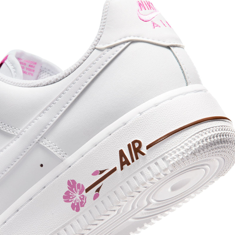 Close-up of white side panel and AIR logo on midsole with pink flower graphics