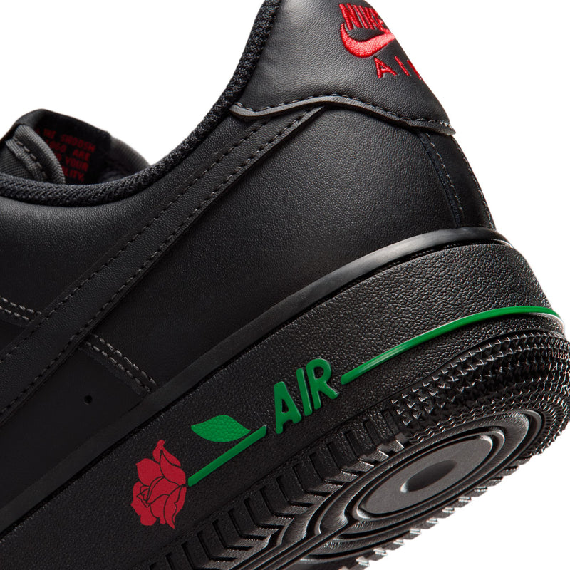 Womens Nike Air Force 1 midsole close-up, black with green AIR stripe and red rose detail