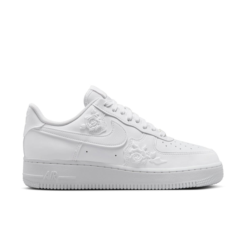 Women's Nike white low-top sneaker with subtle floral emboss detail