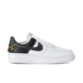 Women's low-top Air Force 1 sneakers in black/white with gold chain heel charms
