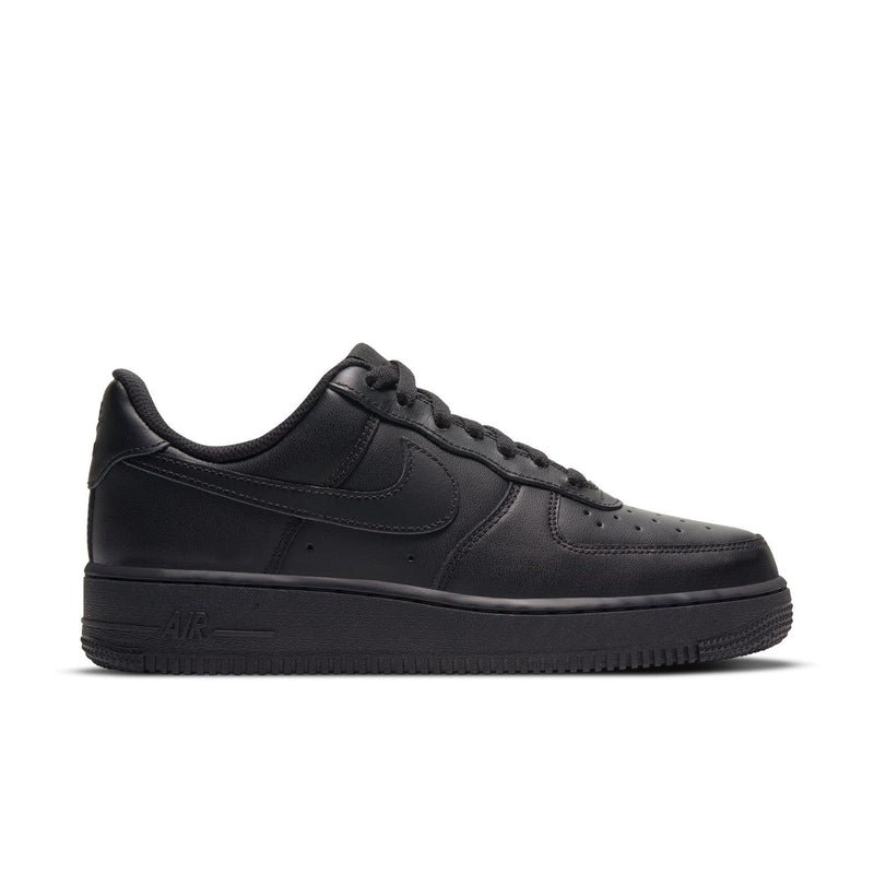 Black women’s low-top sneakers with leather-look uppers and lace-up front