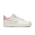 Womens Nike Air Force 1 low-top sneakers in sail white with pink swoosh and laces