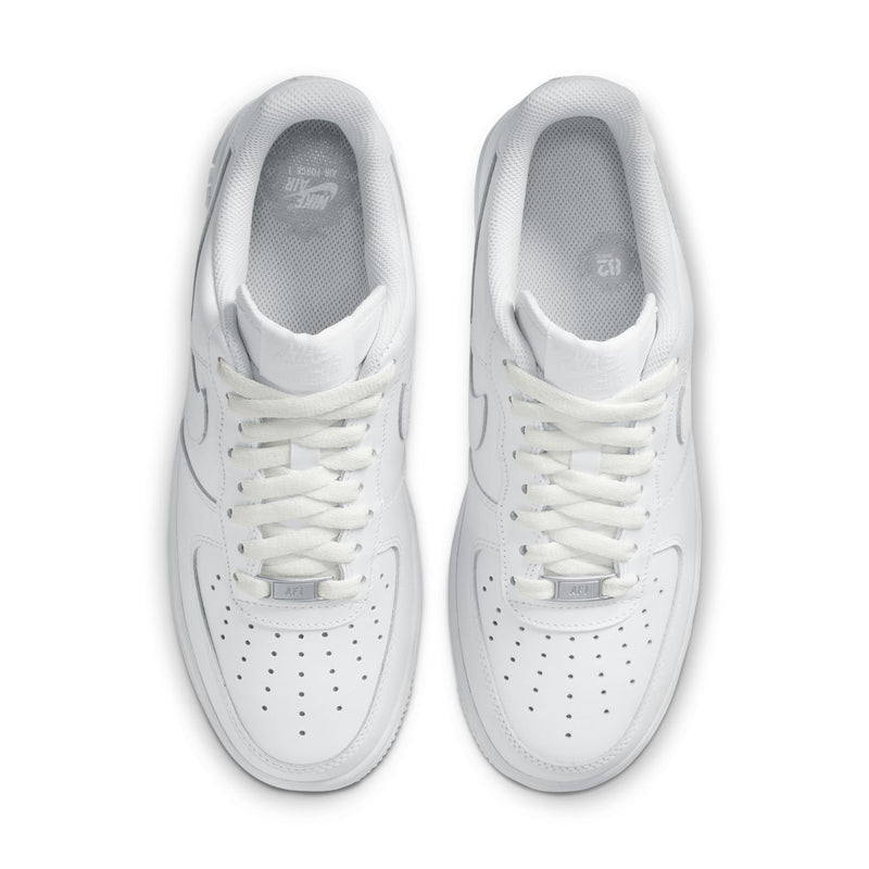 Women's white sneakers, close-up toe and laces with perforation details