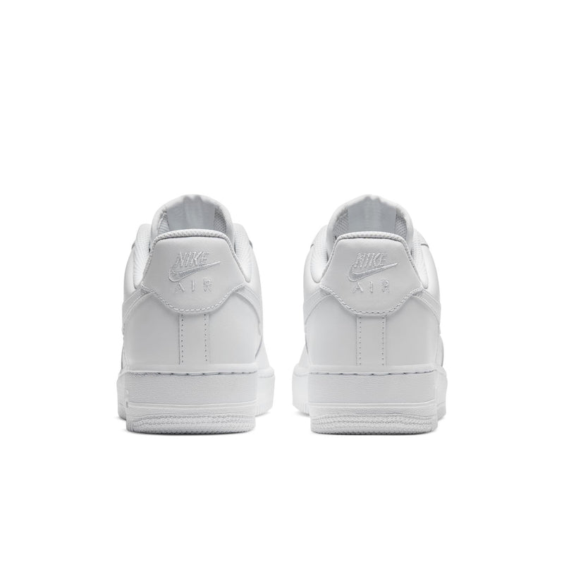 Women's white sneakers, rear view with Nike Air logo on heel tab