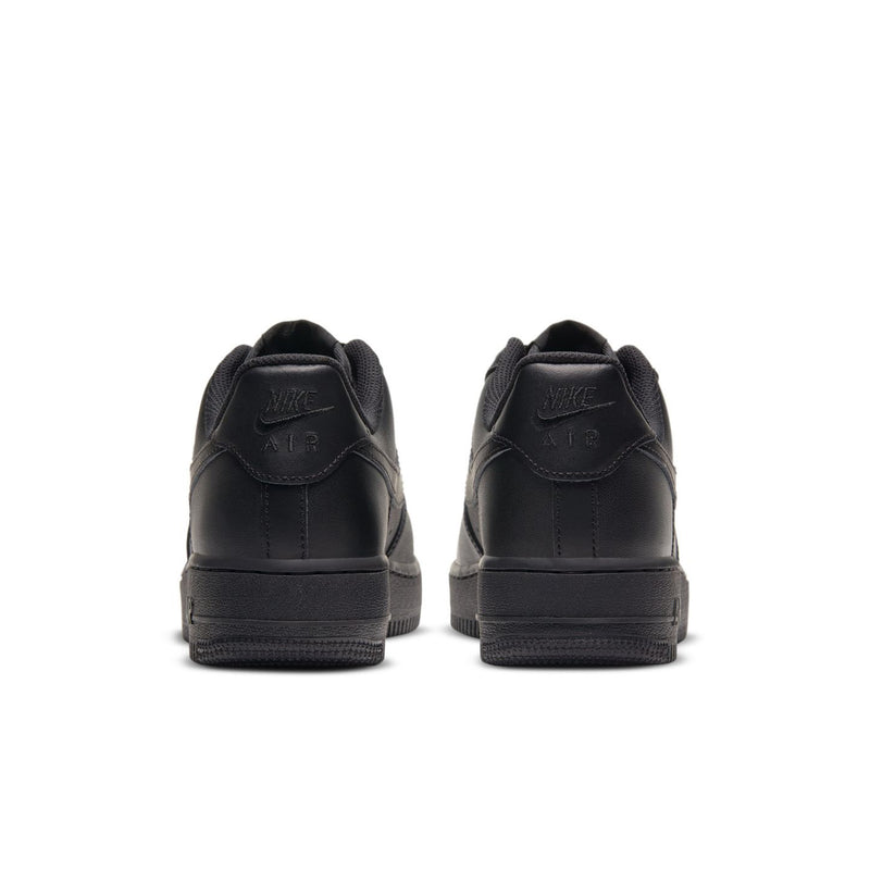 Black women’s sneakers heel view, cushioned collar and stitched logo detail