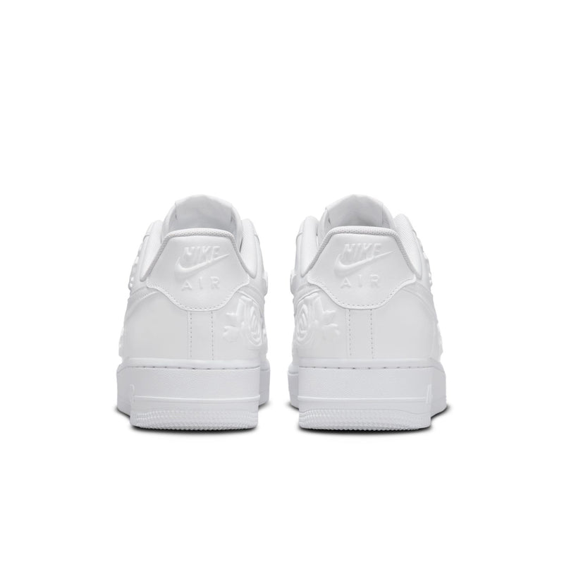 Women's Nike white sneakers, rear view with Air branding on heel tab