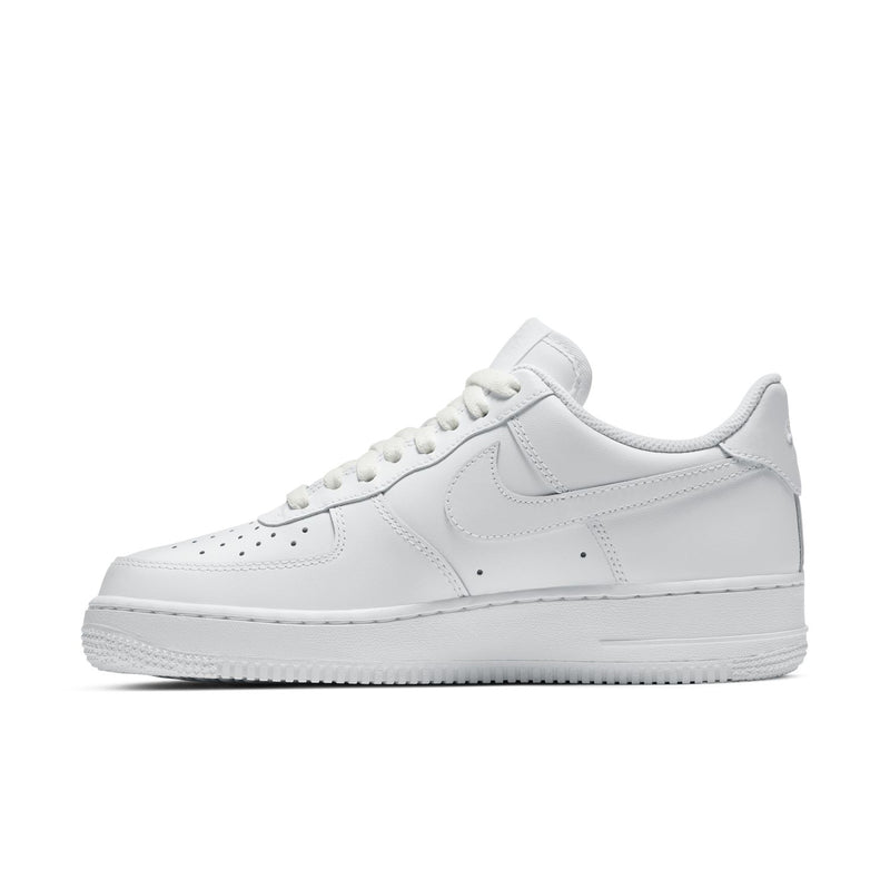 Women's white low-top sneakers, side profile with Nike Swoosh and laces