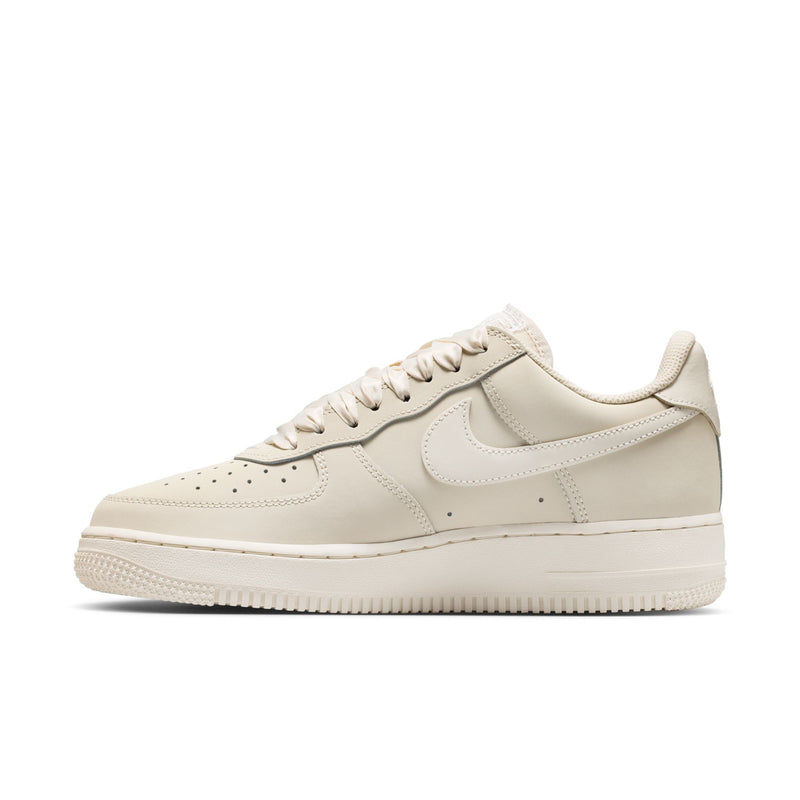 Women's Nike Air Force 1 low-top sneaker, light oatmeal suede with swoosh side