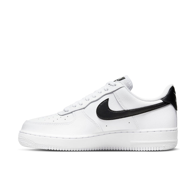 Women’s white low-top sneaker with black Swoosh overlay and lace-up front