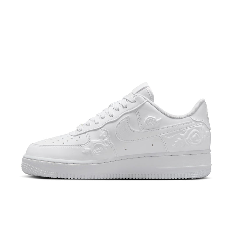 Women's Nike white low-top sneaker with Swoosh and embossed floral toe detail