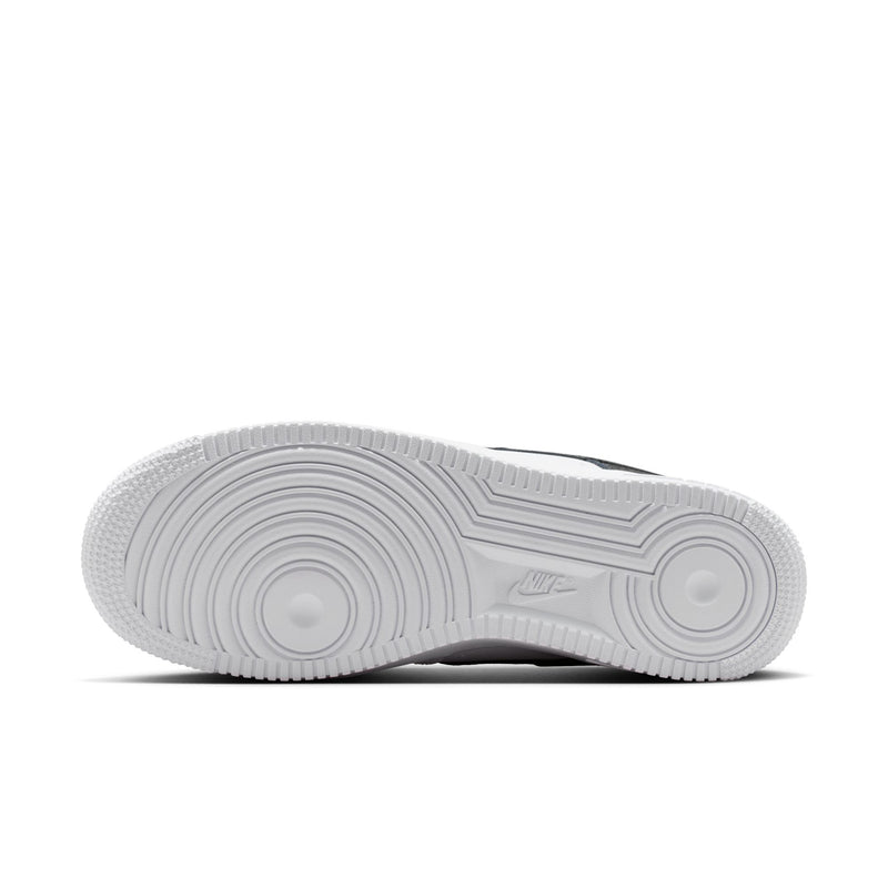 Women's sneaker outsole with circular traction pattern and Nike logo