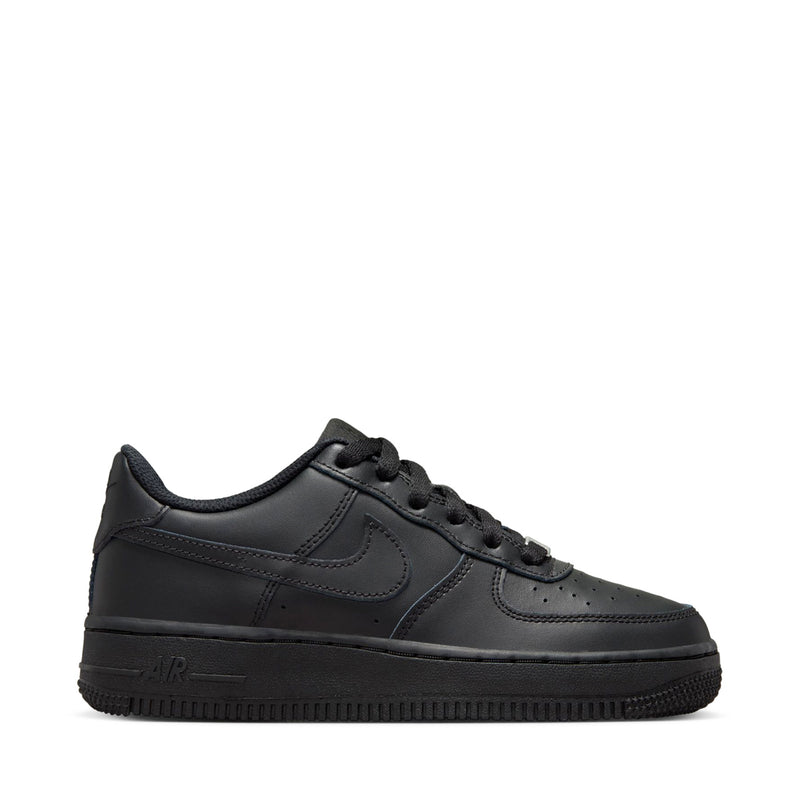 Black Nike youth low-top sneakers, lace-up with swoosh and leather-like panels