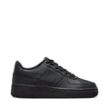 Black Nike youth low-top sneakers, lace-up with swoosh and leather-like panels