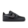 Men's low-top sneakers in black and smoke gray, with Nike Swoosh and lace-up