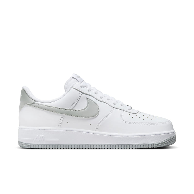 Men's low-top sneakers in white with light smoke gray swoosh and lace-up front