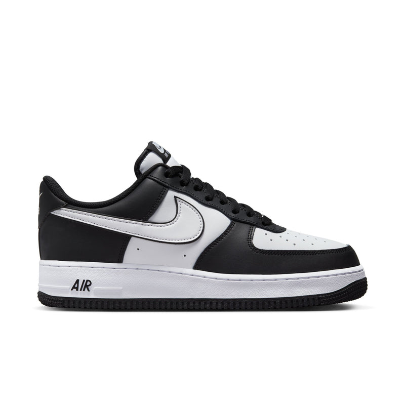 Nike Air Force 1 Low black and white sneakers, front-quarter view with perforated toe box