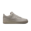 Men's light gray low-top sneakers with lace-up closure and Nike swoosh