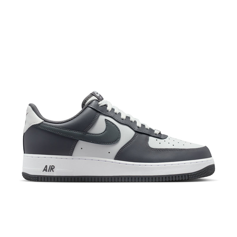 Men's low-top sneakers in dark grey and white with swoosh and Air branding