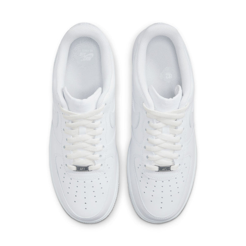 White sneakers viewed from above with lace-up tongues and perforated toe detailing