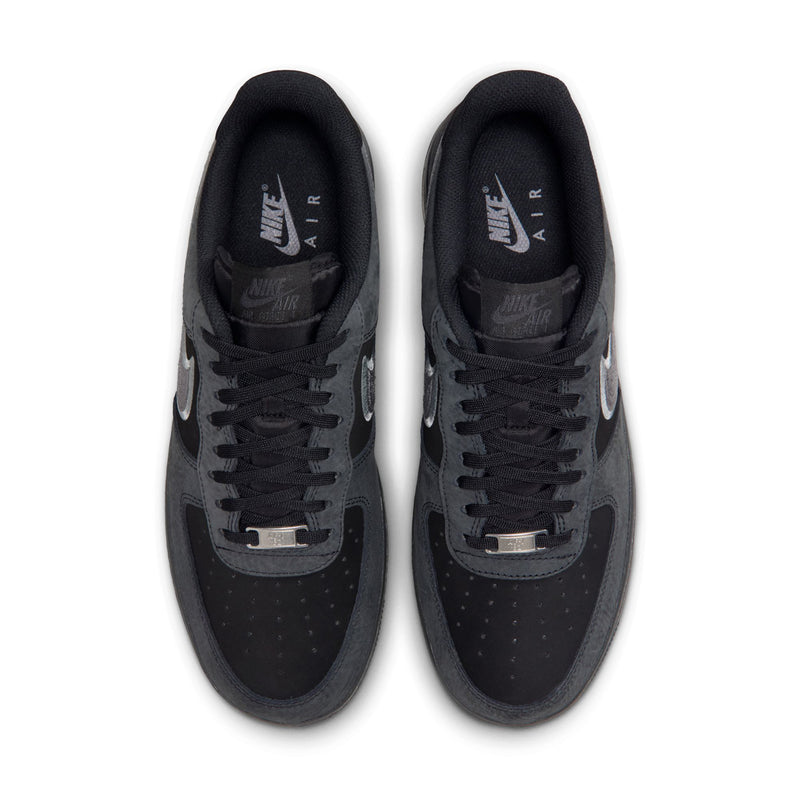 Men's low-top sneakers, top view: black uppers with lace eyelets and Nike logo