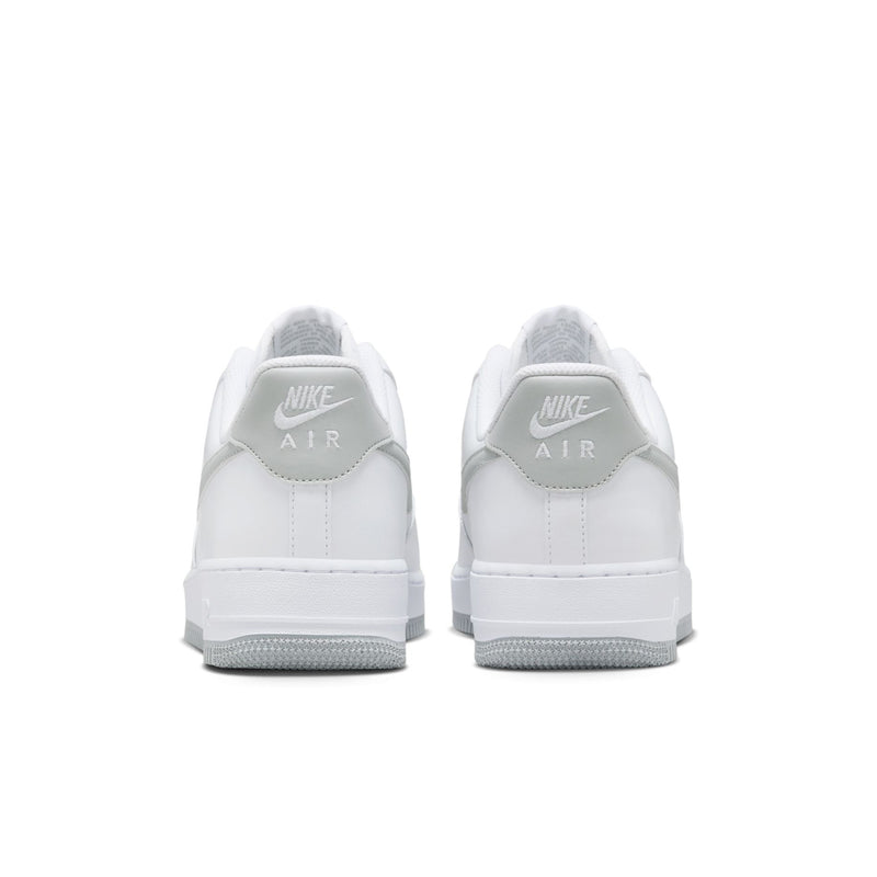 Men's white low-top sneakers, back view with Nike Air branding on heel