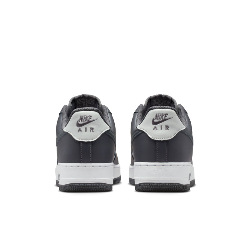 Men's low-top sneakers rear view with dark heel panels and white outsole