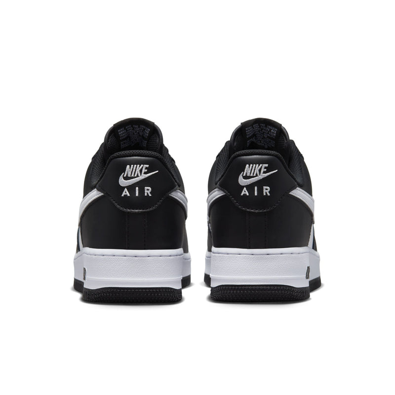 Nike Air Force 1 Low black and white leather sneakers with Nike Air heel logo, lace-up