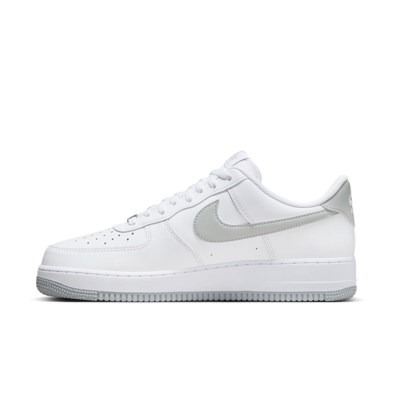 Men's white low-top sneakers with side swoosh in light smoke gray and lace eyelets